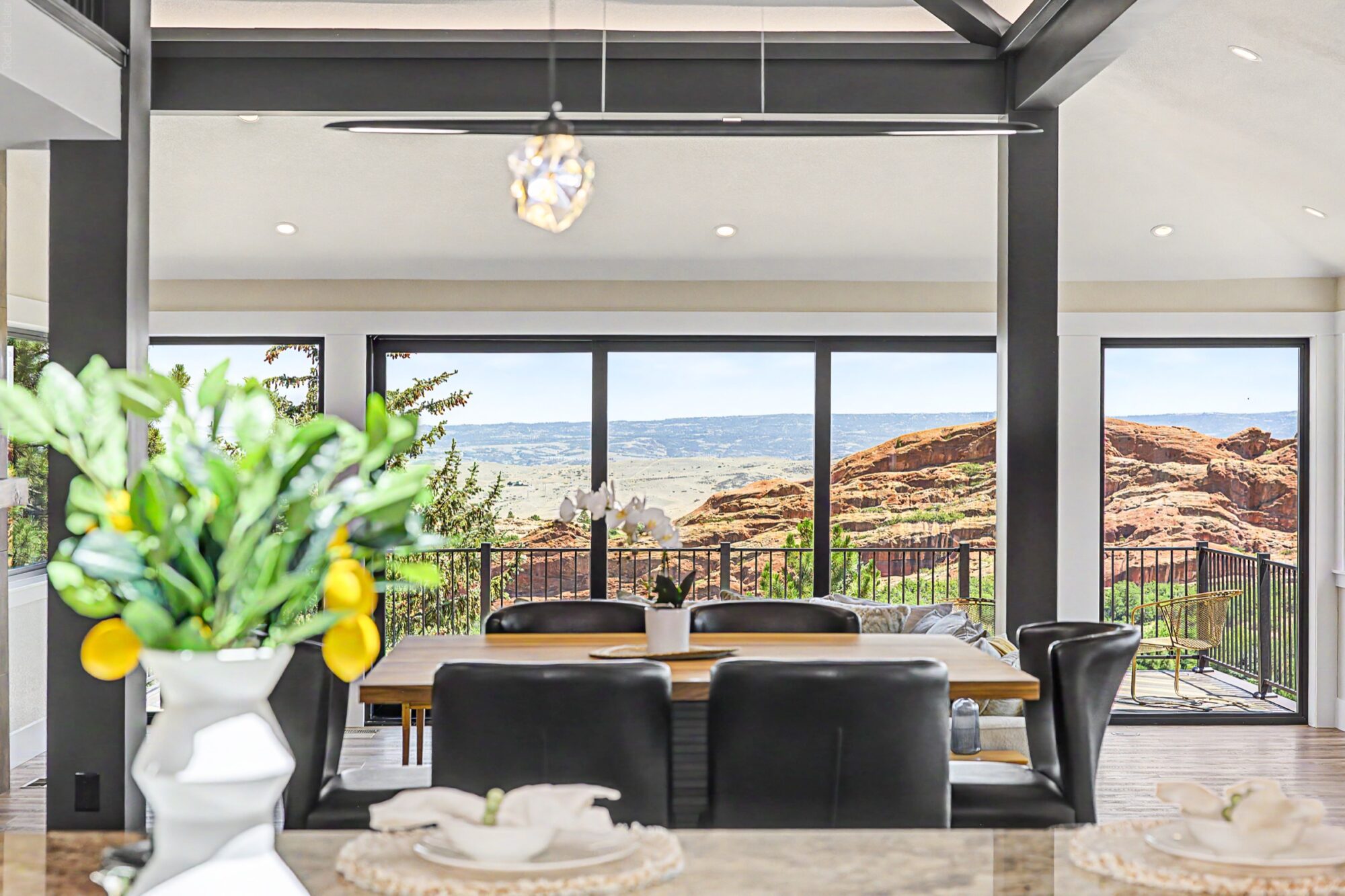 Jet Black Win-Dor 3750 Series sliding patio door between tall picture windows, interior view from the dining area.